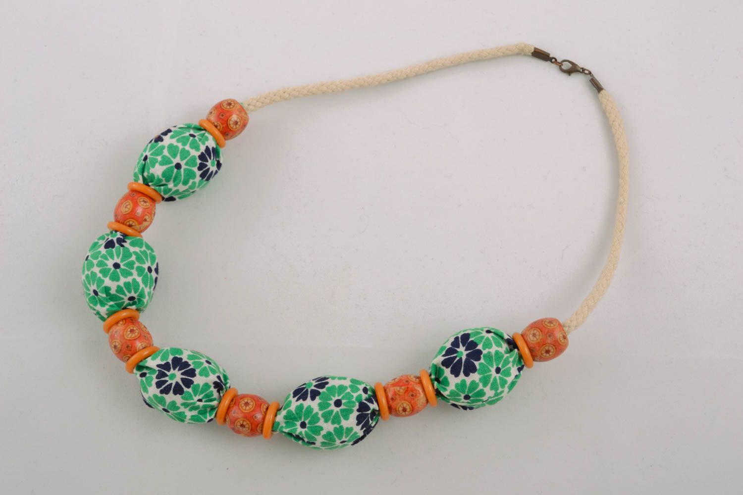 Textile necklace with wooden beads photo 1
