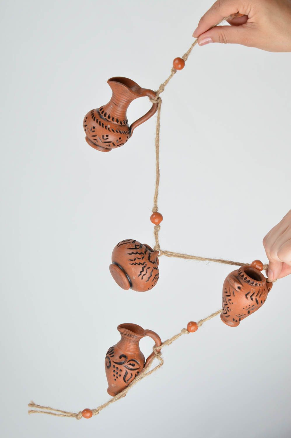 Designer interior pendant in shape of garland made of ceramic decanters photo 3