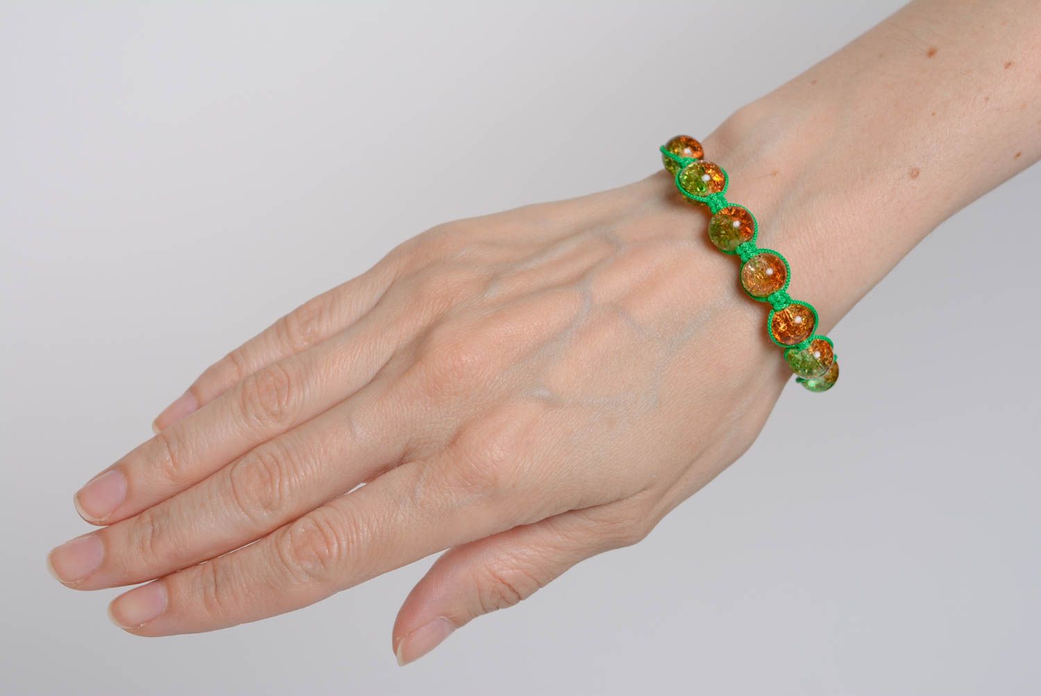 Handmade bracelet made of plastic beads on waxed cord braided green accessory photo 5