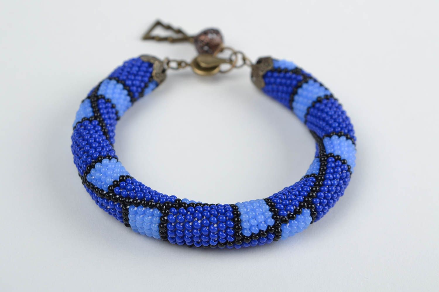 Handmade beautiful blue beaded cord bracelet with geometric paint photo 4
