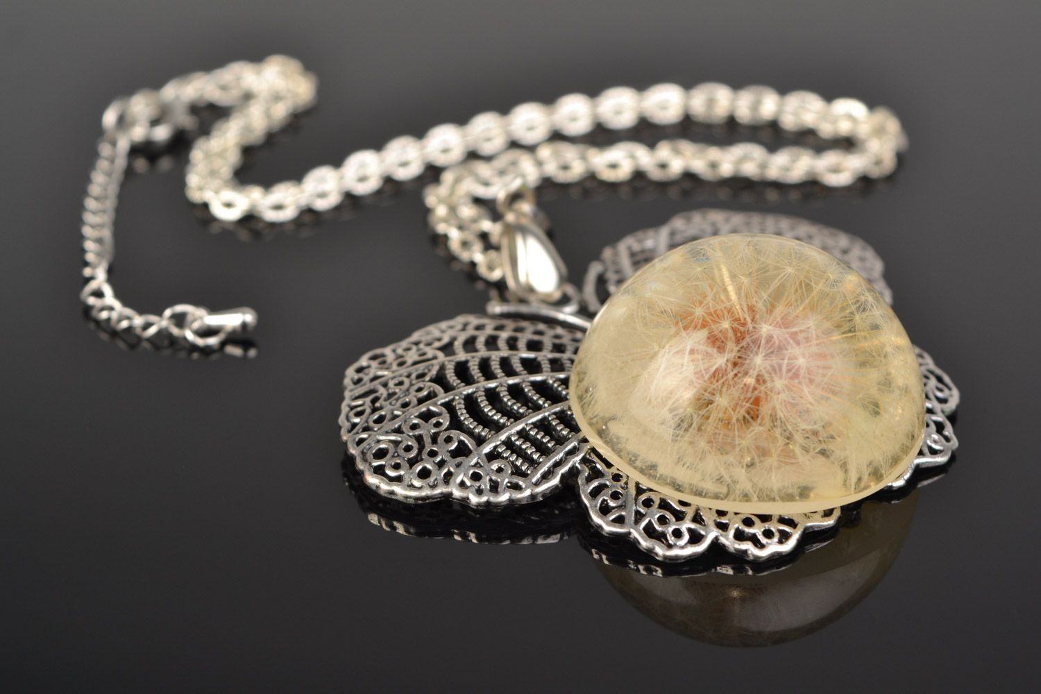 Tender handmade round pendant with dandelion flower in epoxy resin on chain  photo 1