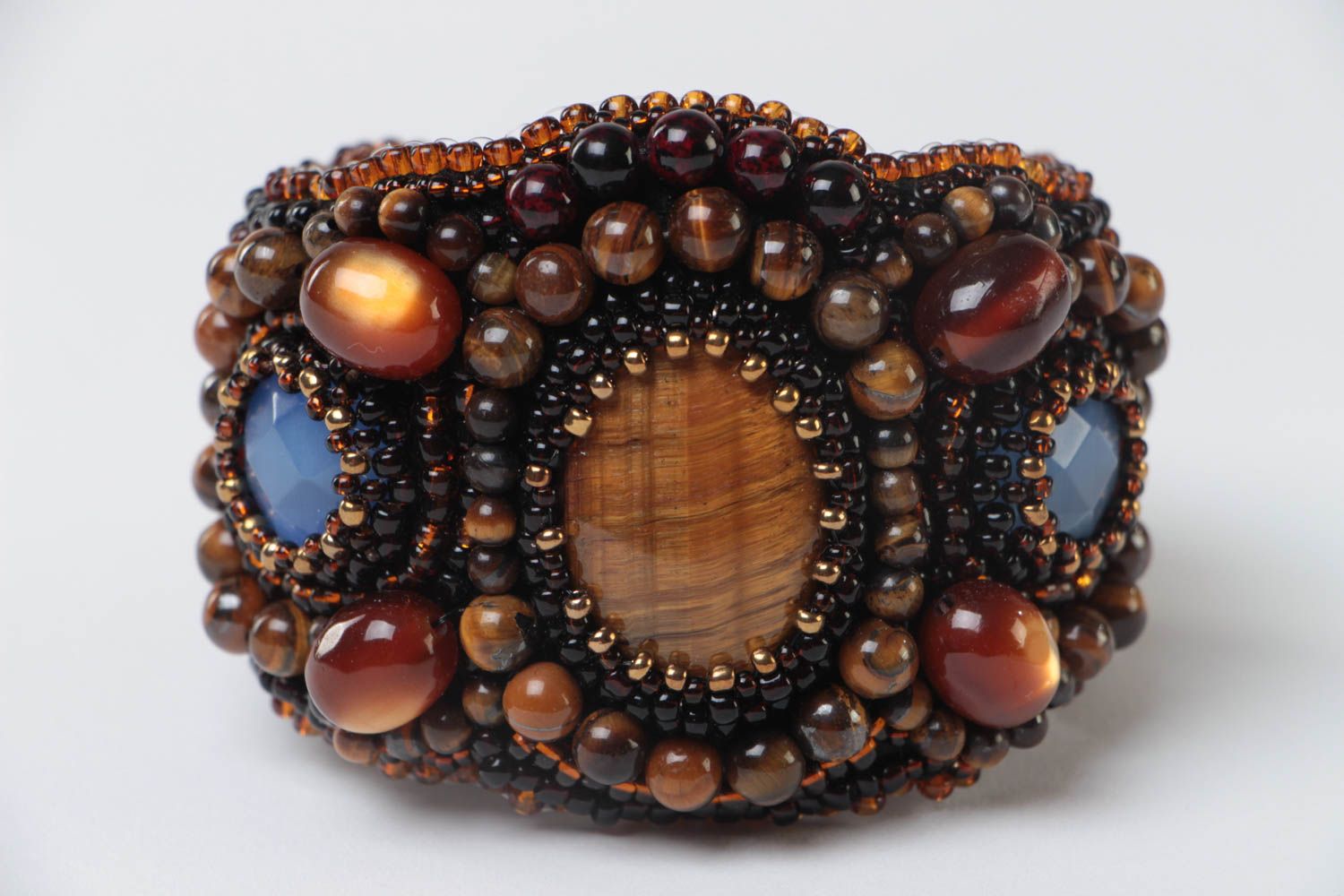 Beautiful handmade women's beaded bracelet with natural stones on leather basis photo 3