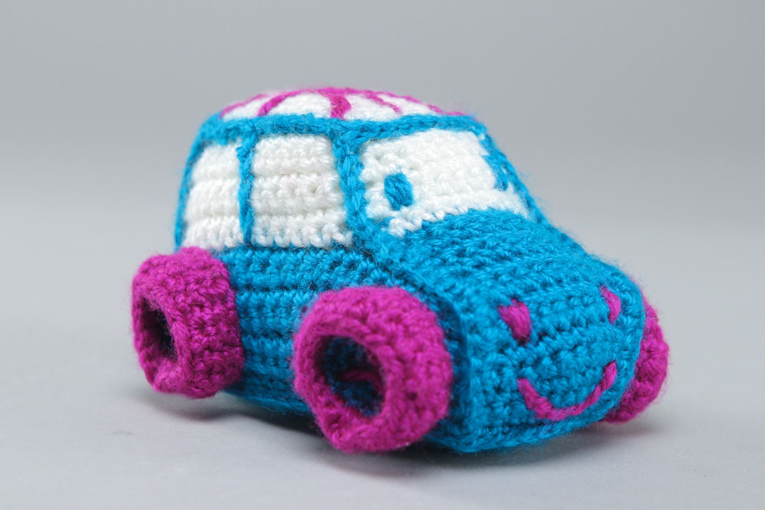 Handmade soft toy in the shape of small car crocheted of acrylic threads photo 1