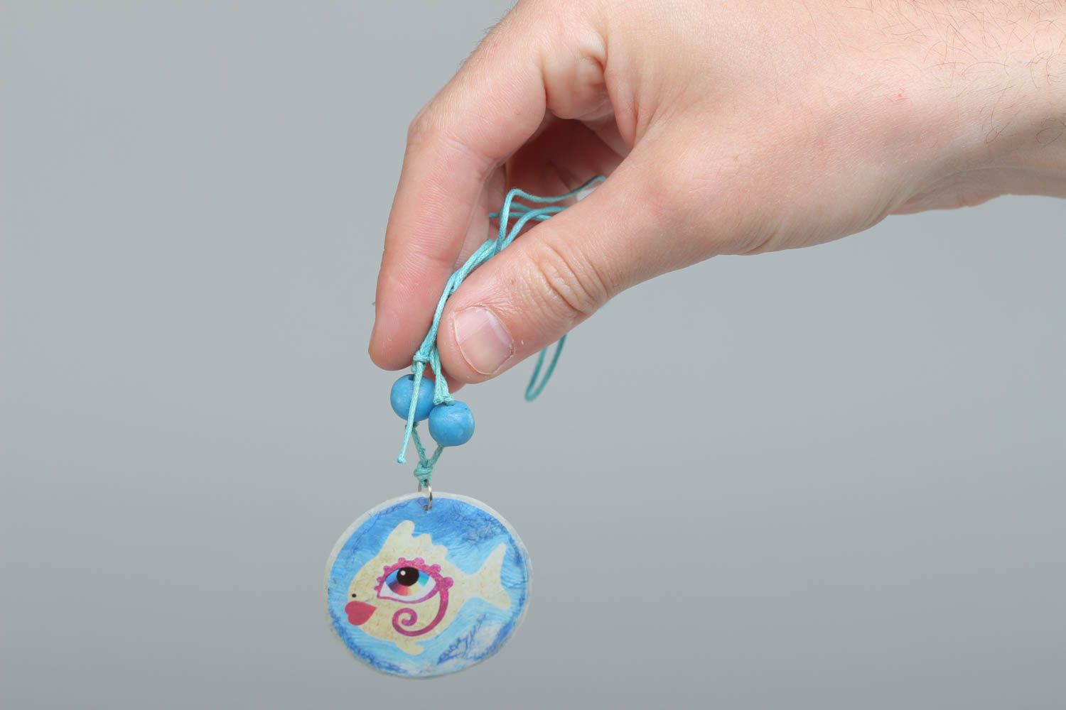 Handmade round shape pendant with blue fish print made of polymer clay photo 5