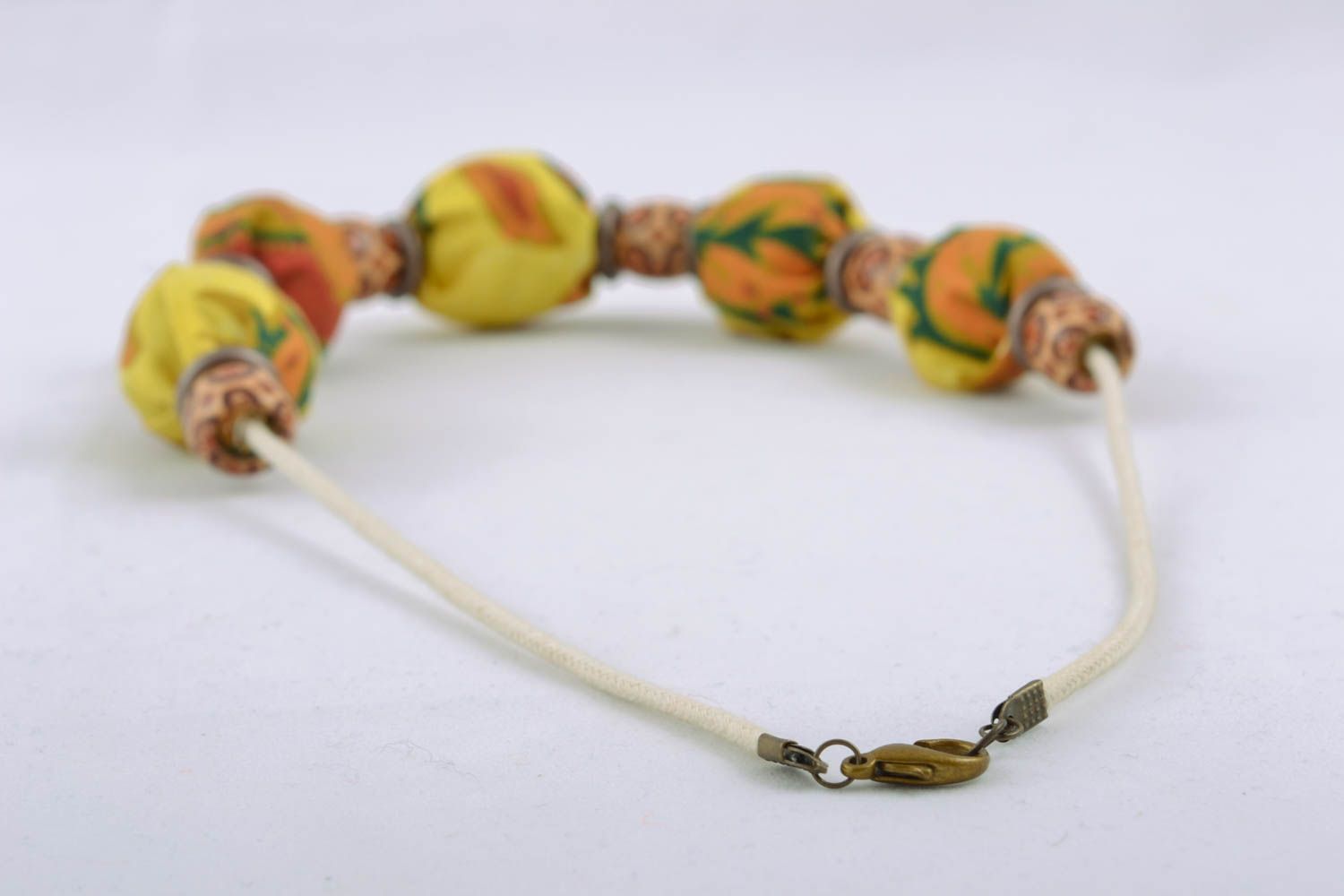 Textile necklace with wooden beads and nuts photo 3