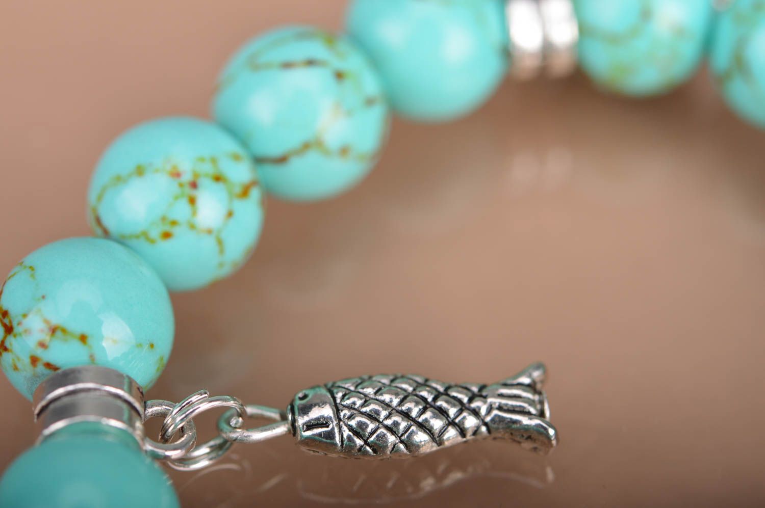 Handmade beaded wrist bracelet styled on turquoise with metal charms fish leaves photo 4