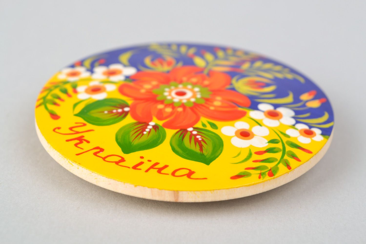 Handmade painted wooden souvenir fridge magnet of round shape in Ukrainian style photo 3
