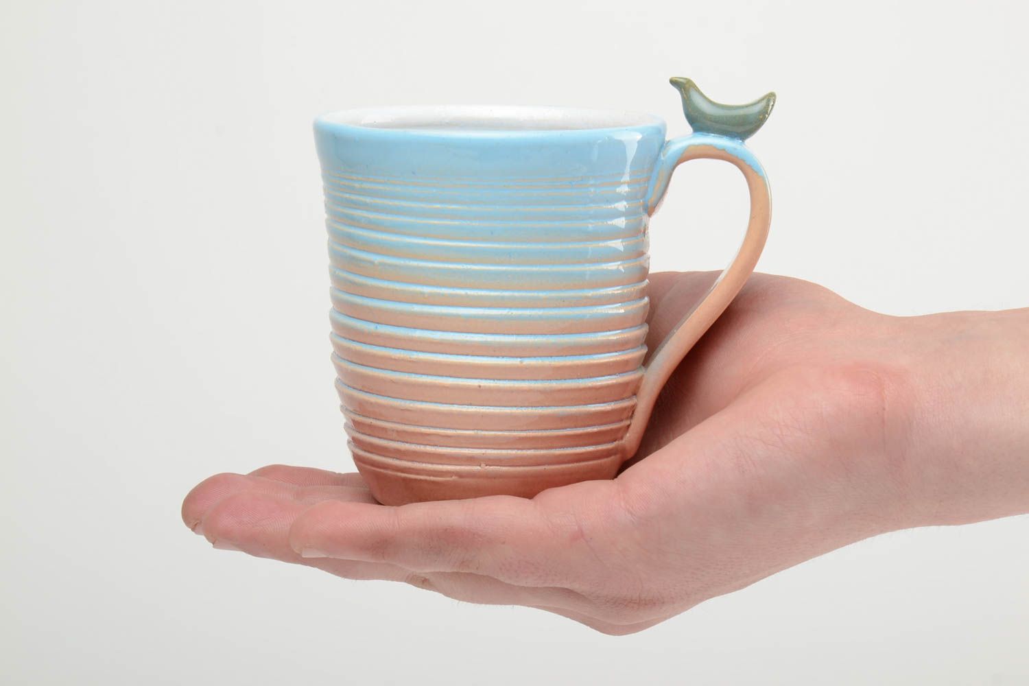 10 oz porcelain handmade drinking cup in blue, white, and beige colors with handle photo 5