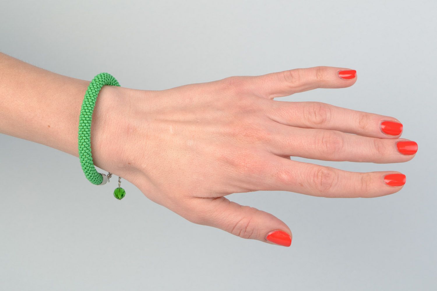 Beautiful handmade tender green beaded cord women's wrist bracelet with charm photo 1