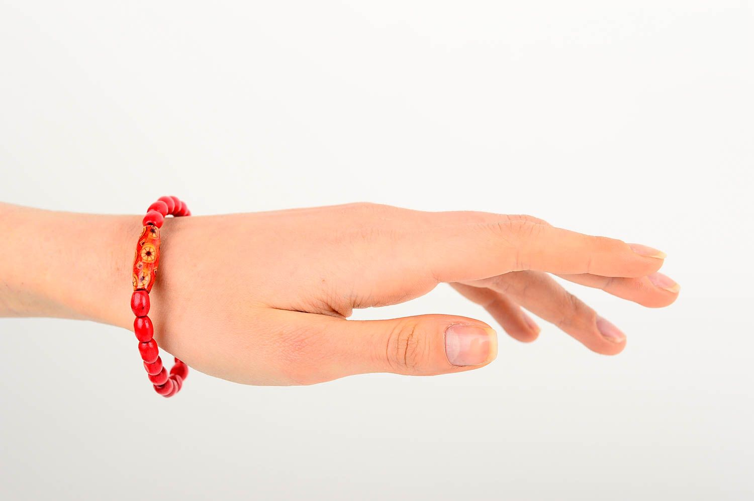 Wooden red beaded handmade wrist bracelet on elastic cord for girls and women photo 2