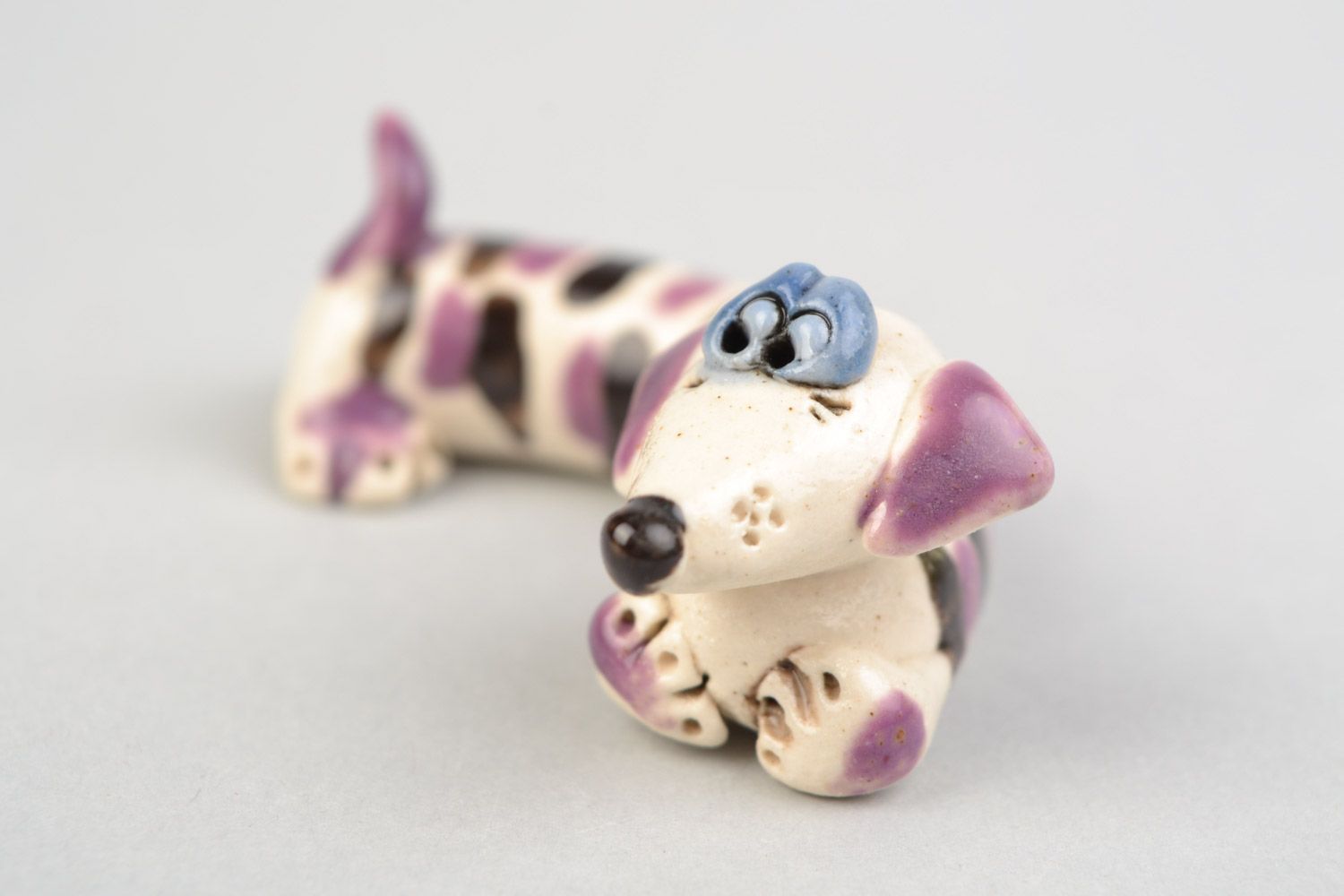 Handmade souvenir ceramic figurine of funny striped badger dog painted with glaze photo 1