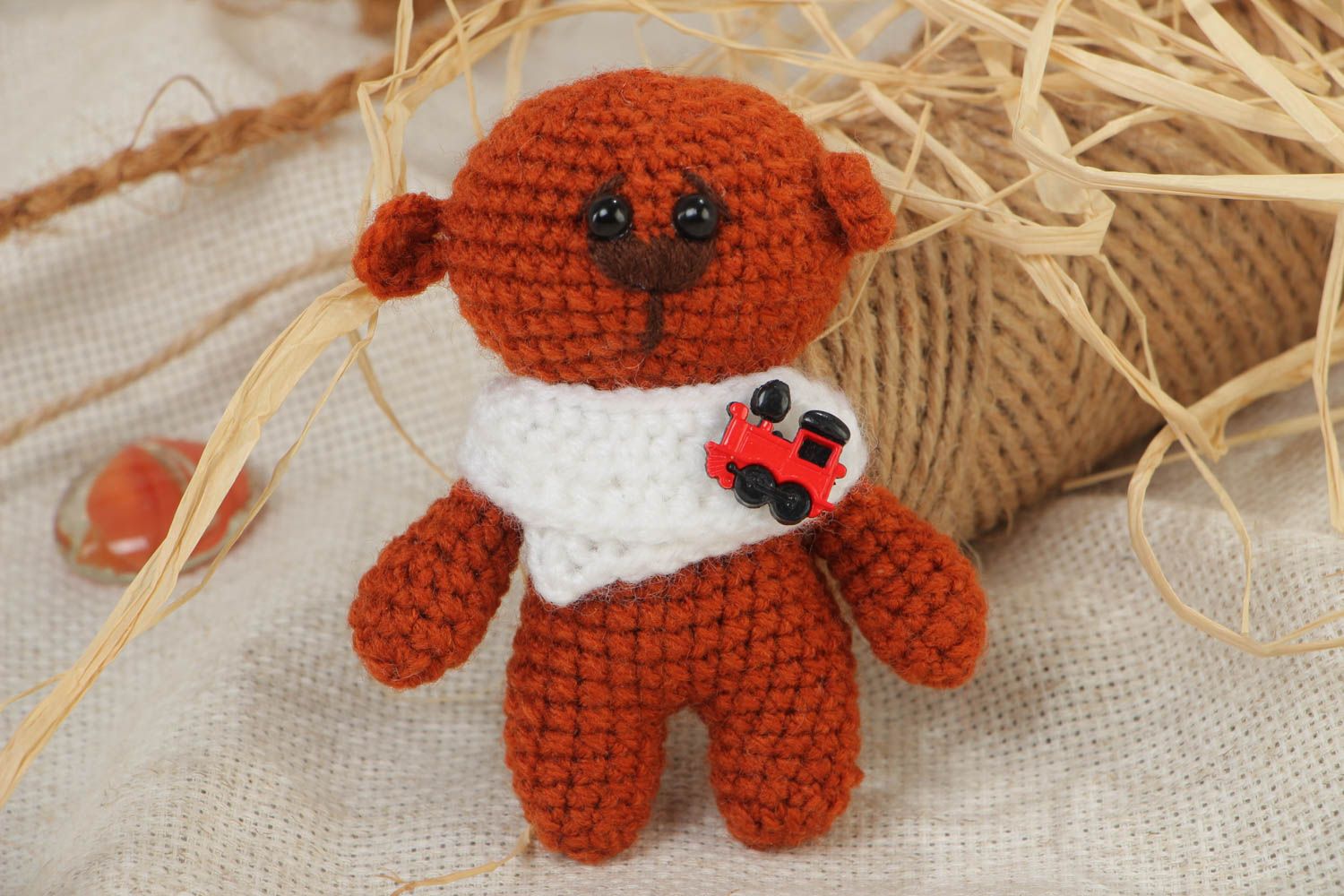 Soft handmade crocheted toy bear in brown with a small collar present for baby photo 1