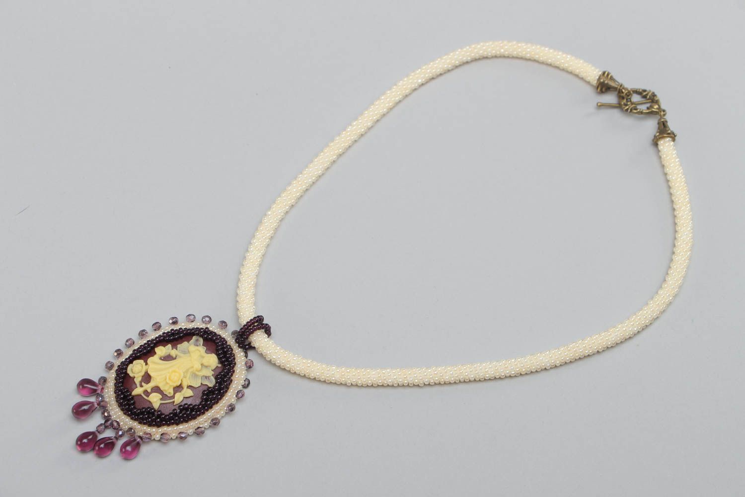 Light oval handmade unusual beaded pendant for women photo 2