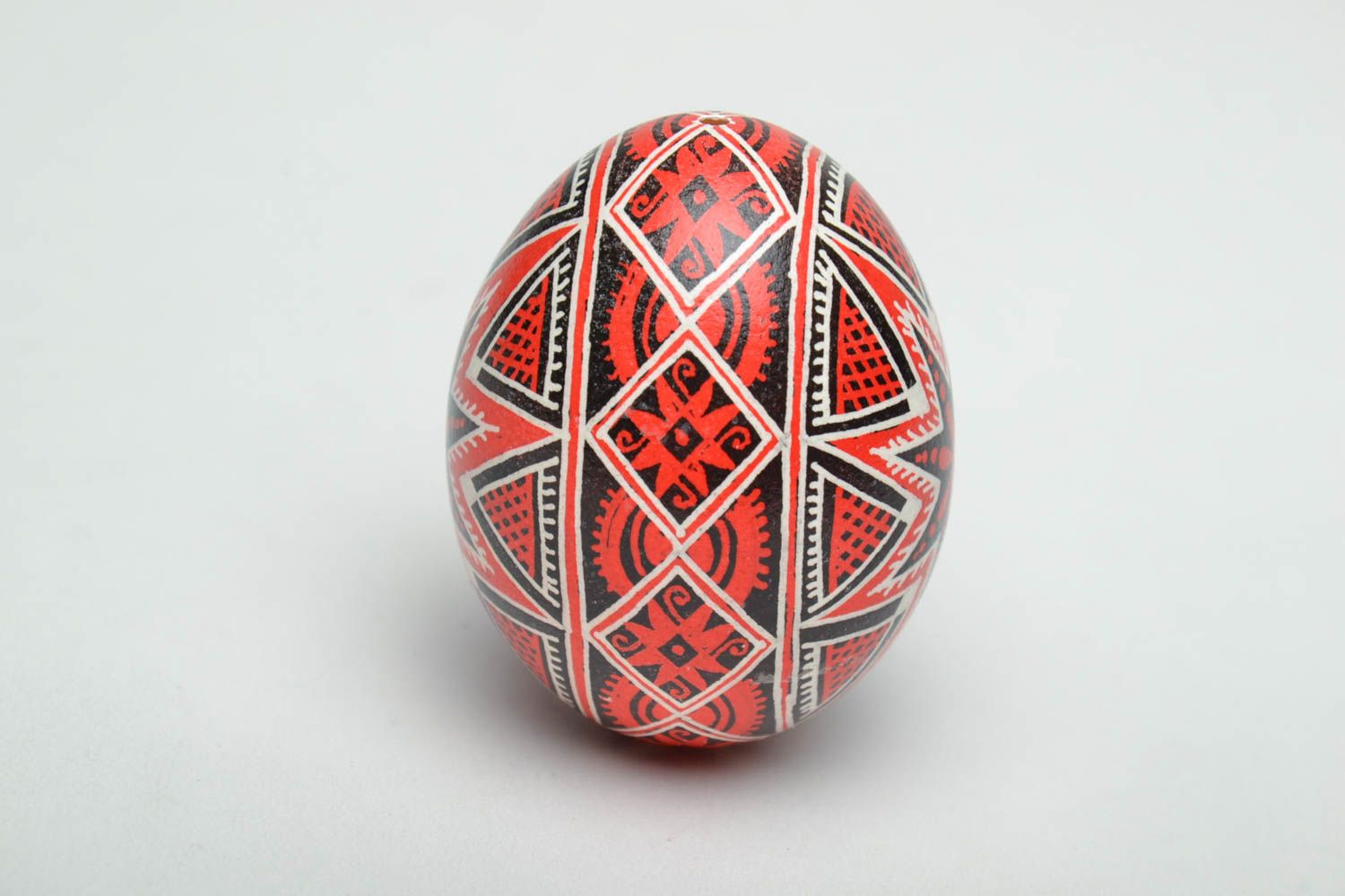 Handmade Easter egg painted with red and black colors photo 3