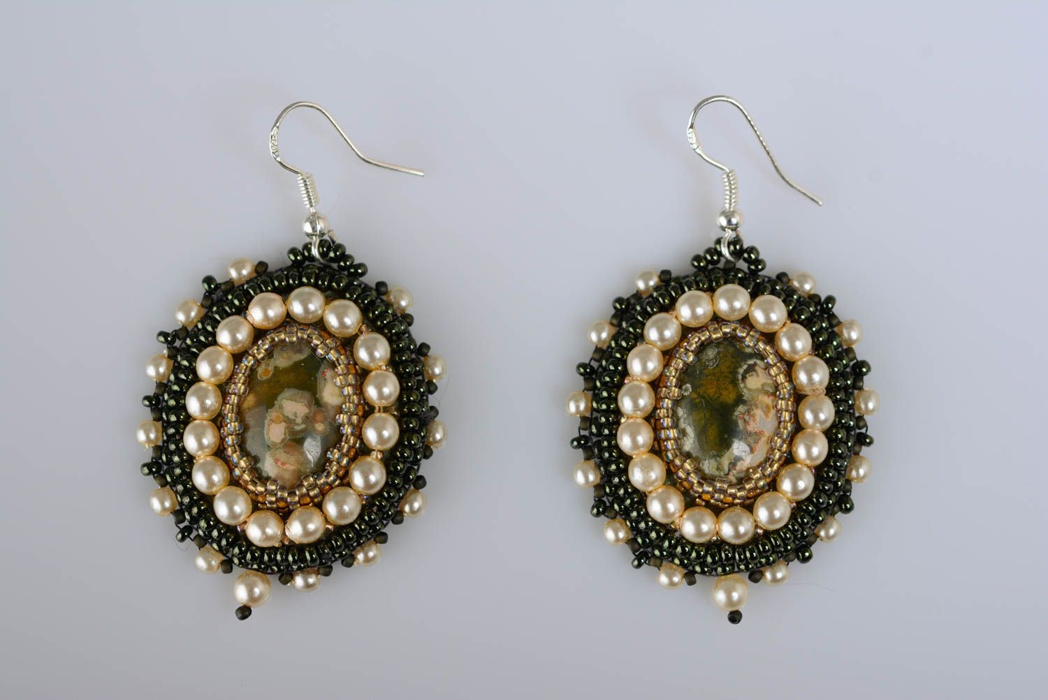 Handmade oval shaped festive dangling earrings embroidered with beads and jasper photo 1