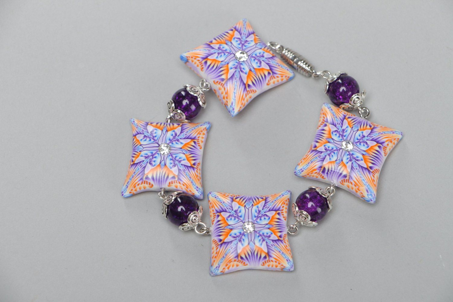 The pink bracelet on chain with colorful ornament square beads photo 2