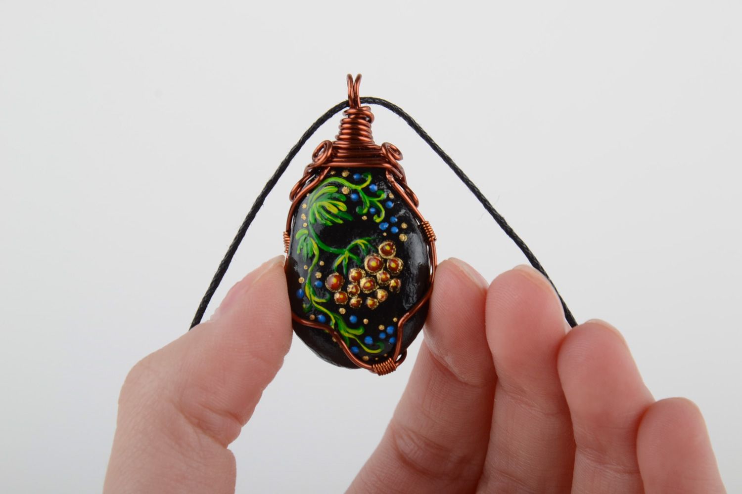 Unusual handmade plastic pendant woven over with copper wire and equipped with cord photo 4