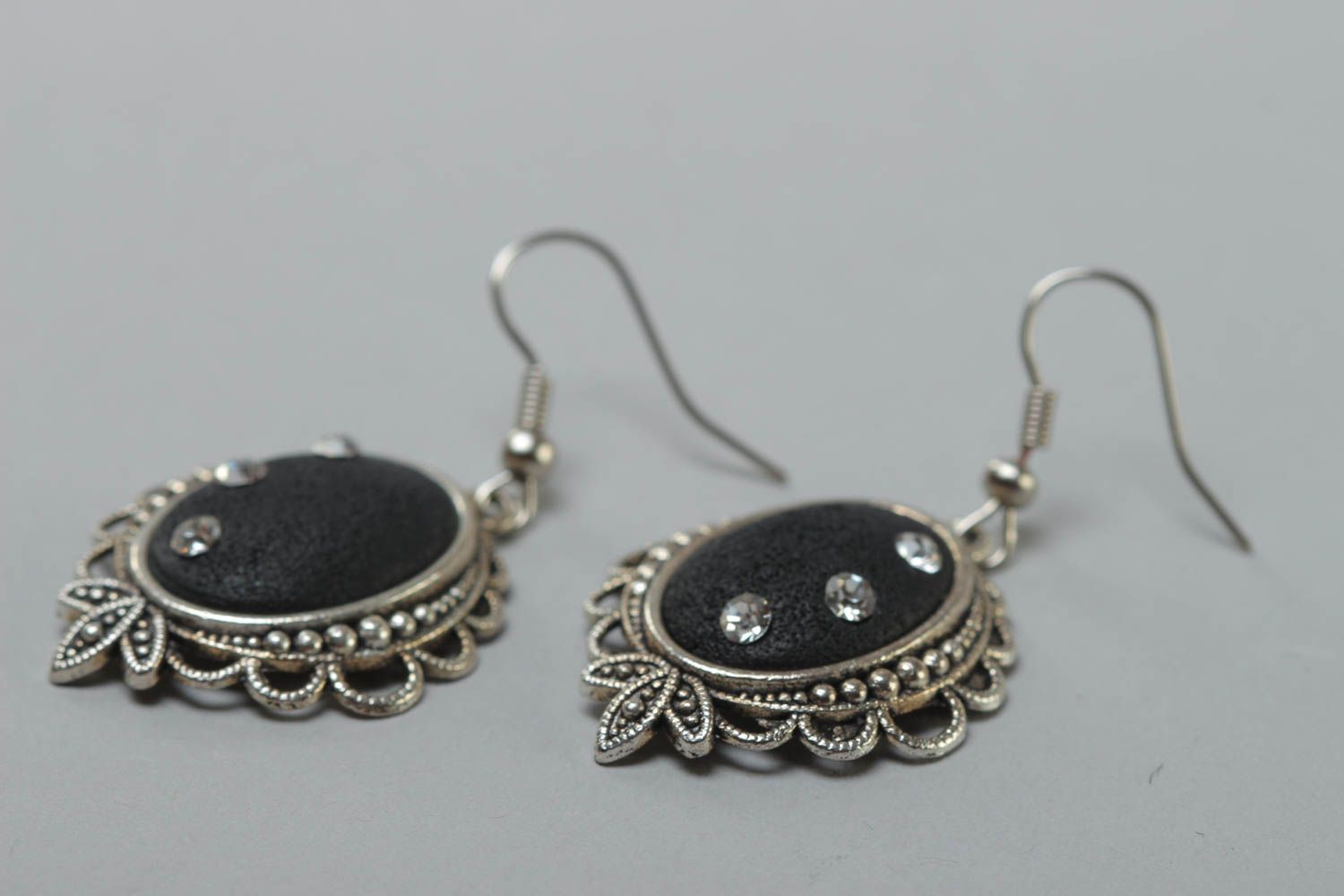 Black handmade oval polymer clay earrings in metal frame photo 3