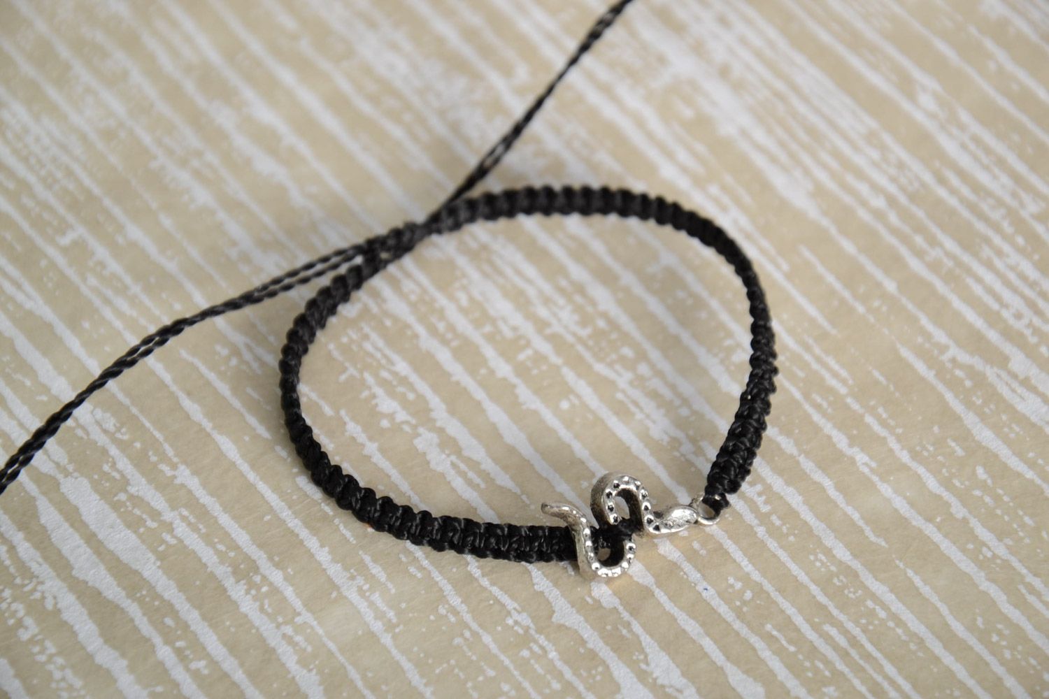 Handmade black macrame woven bracelet with metal snake charm for women photo 1