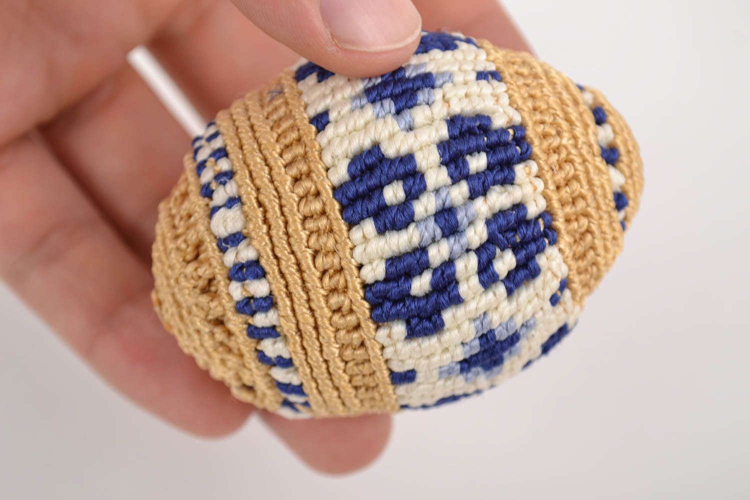 Handmade decorative macrame woven Easter egg on stand blue and beige pattern photo 2