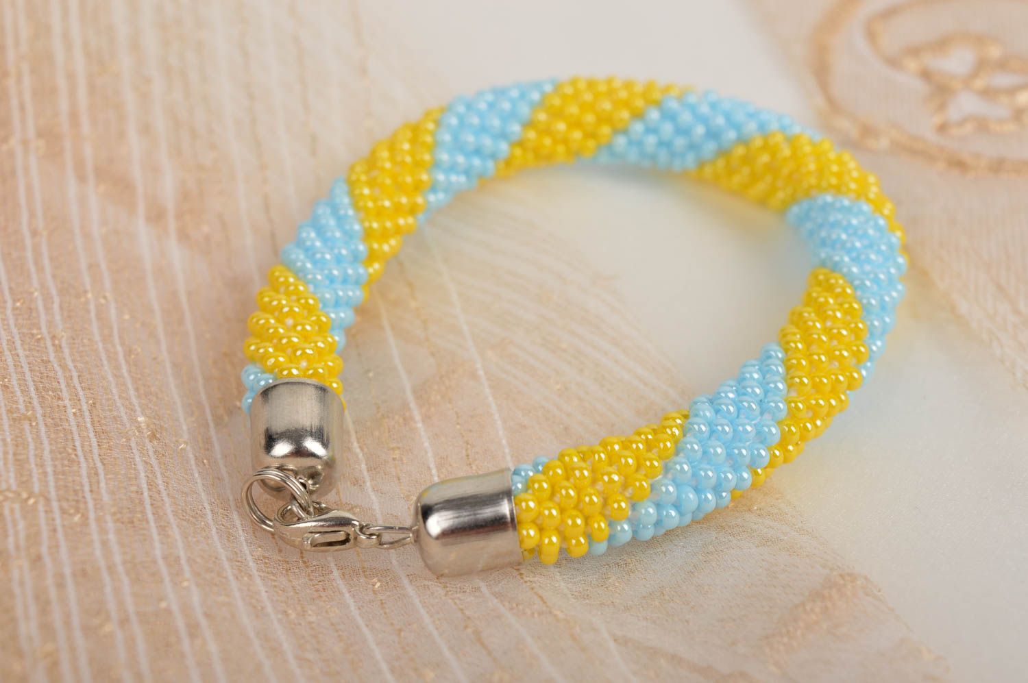Homemade cord made of Czech beads adjustable bracelet in yellow and blue color photo 1