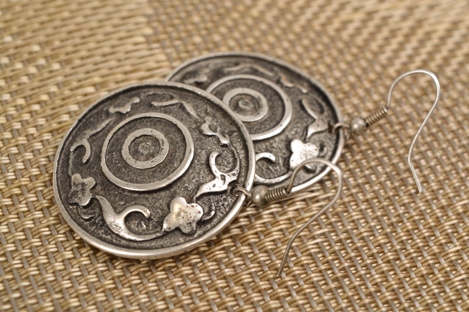 Unusual metal earrings of round shape photo 1
