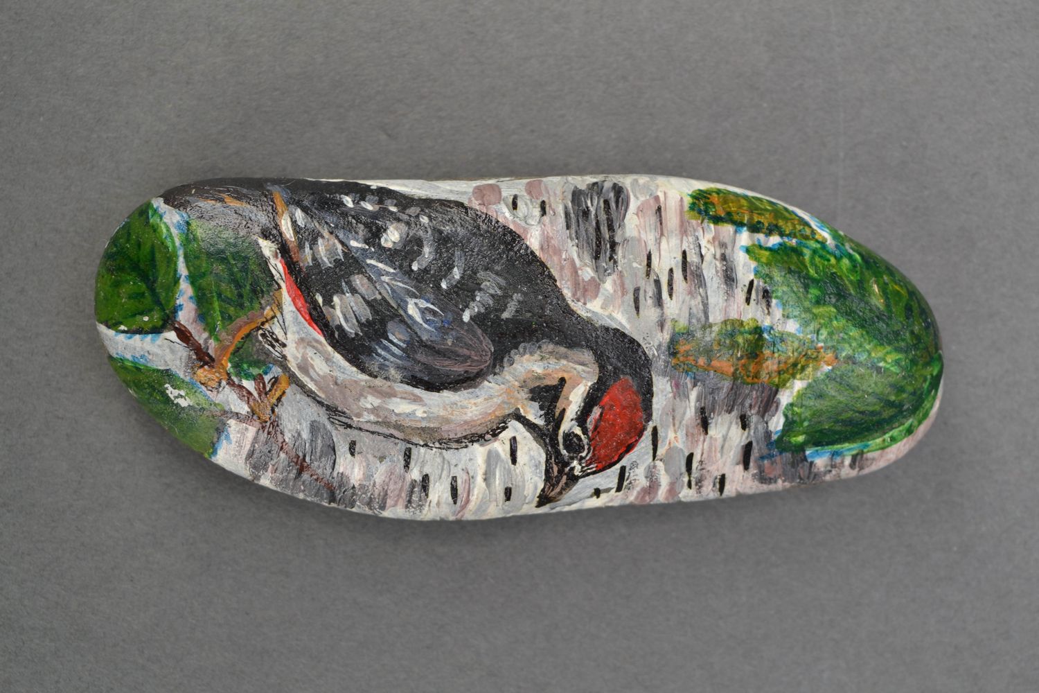 Painted sea stone for decor Woodpecker photo 1