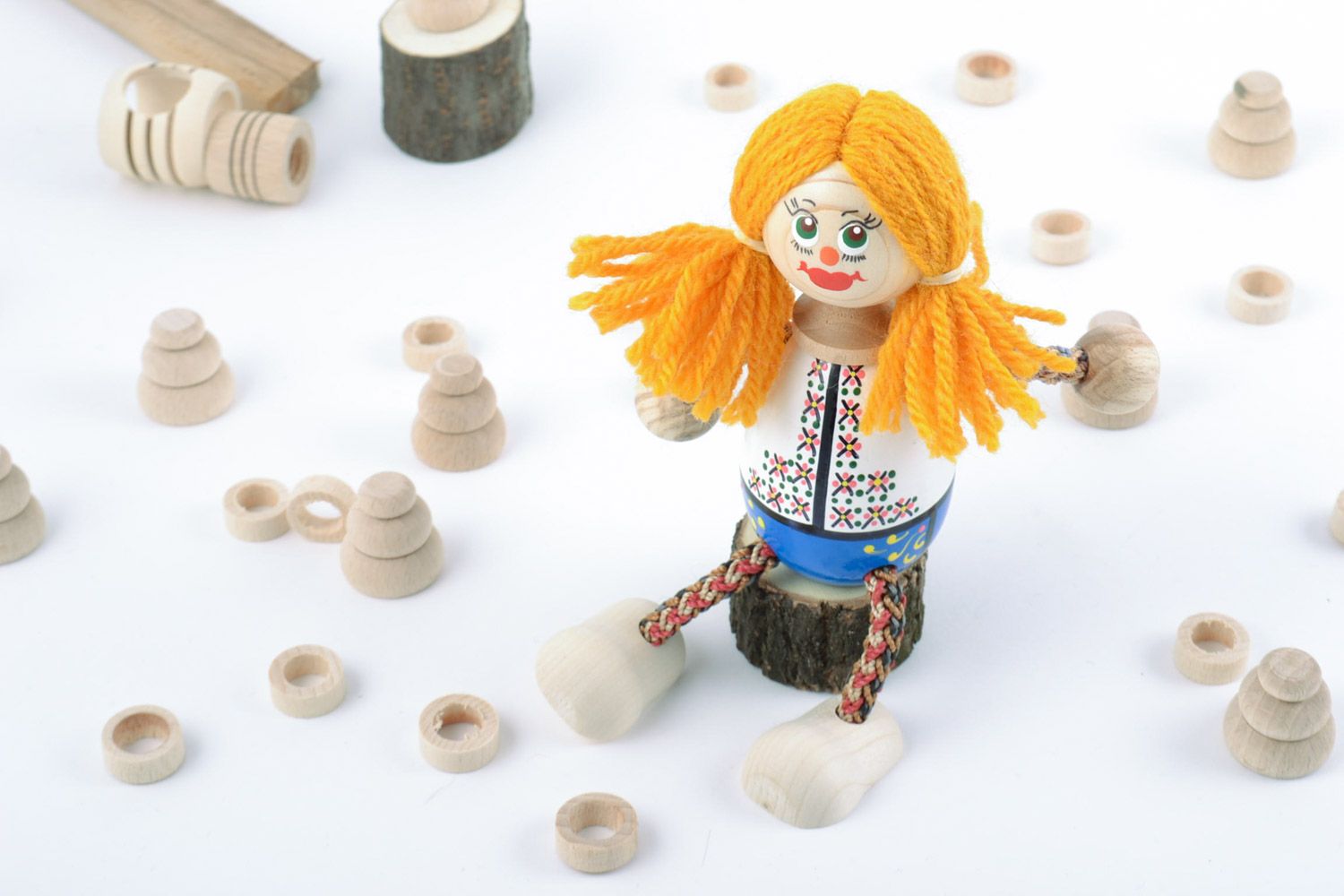 Handmade small painted wooden eco toy girl with bright yellow hair for kids photo 1
