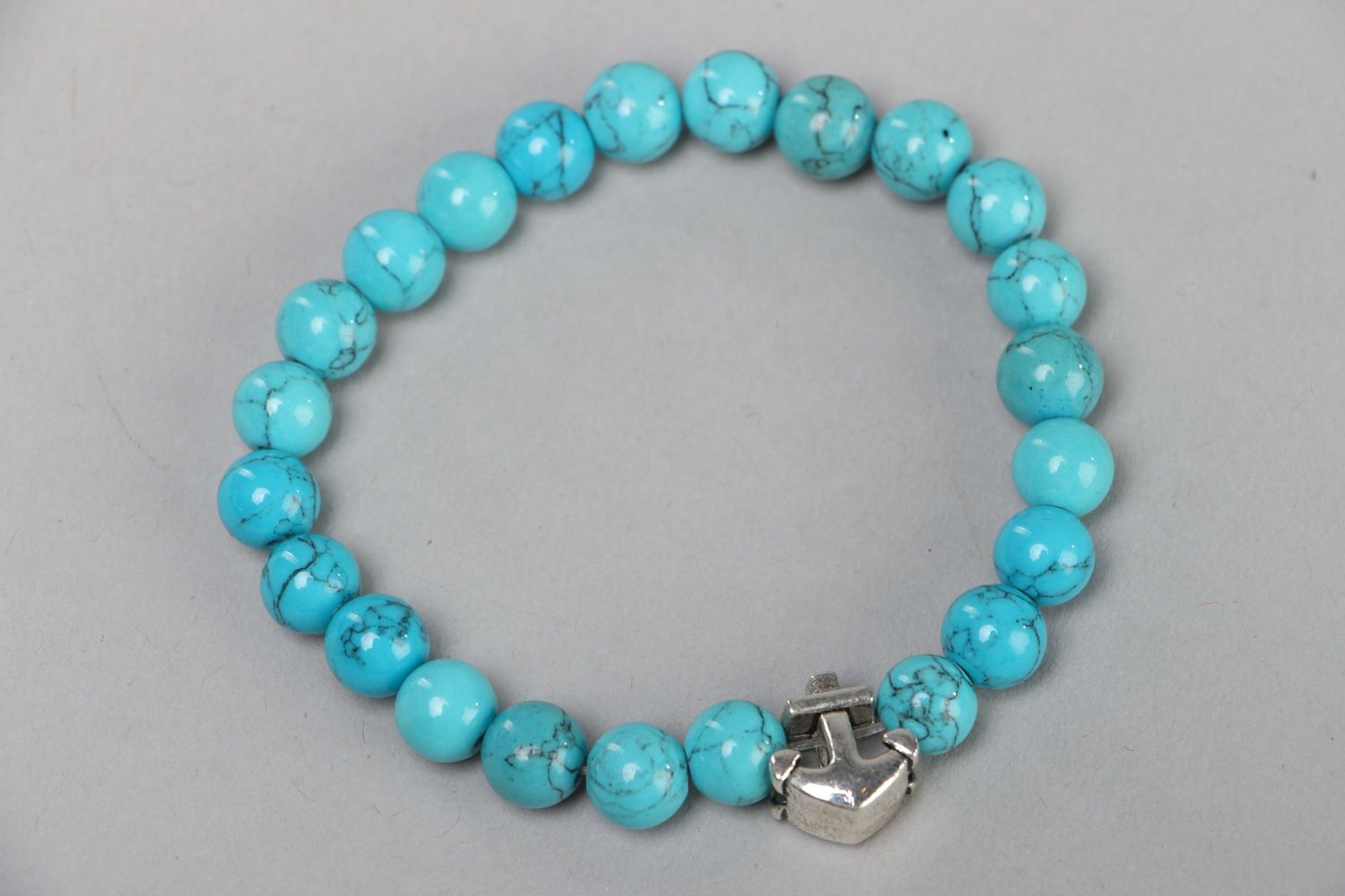 Handmade wrist stretch bracelet with turquoise beads and metal anchor charm photo 1