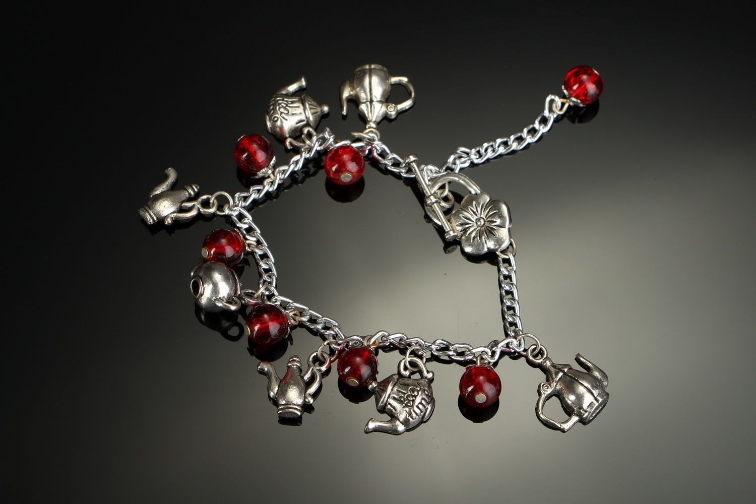 Bracelet en acier et perles de verre Théières photo 1