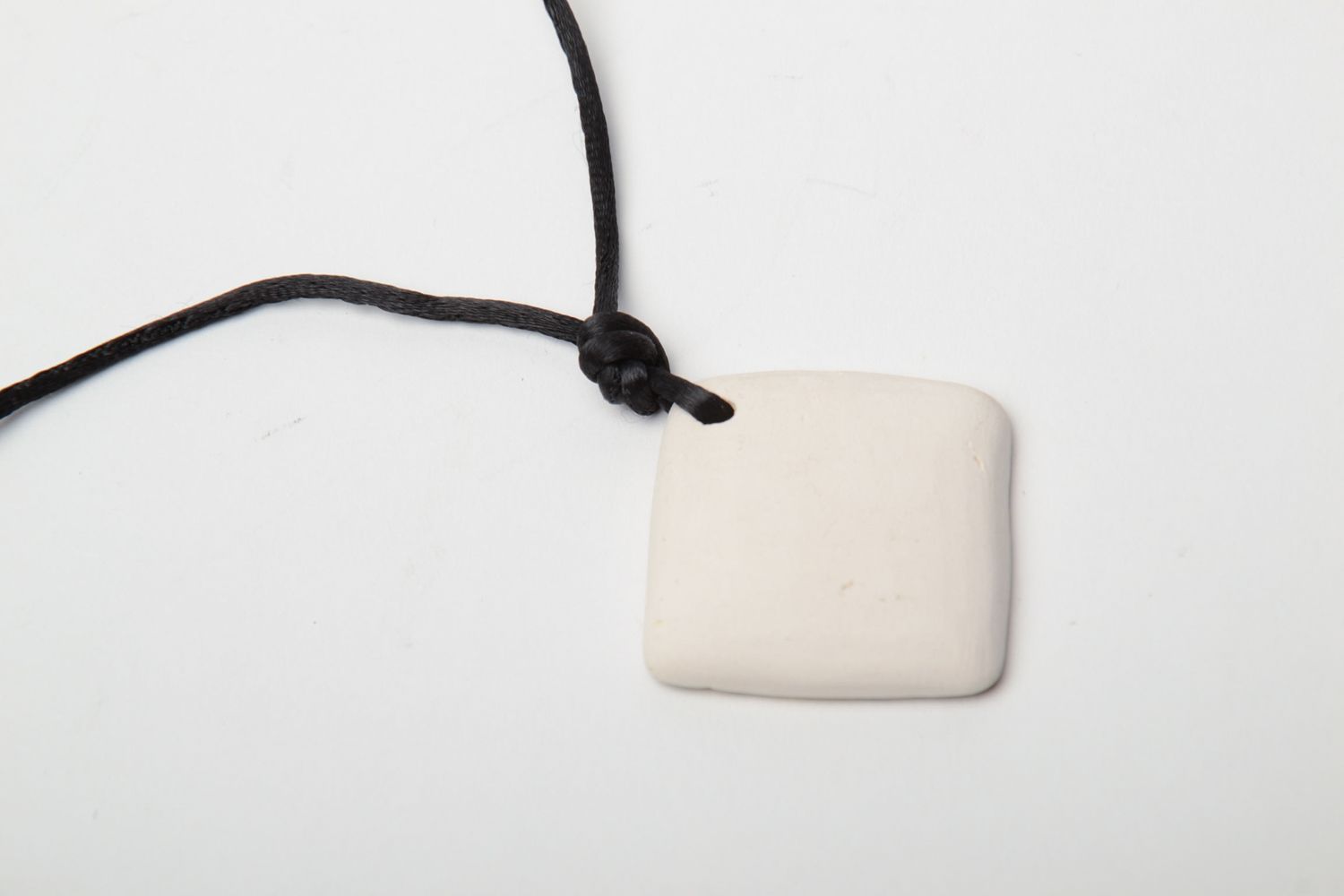 Painted clay pendant with cord photo 5
