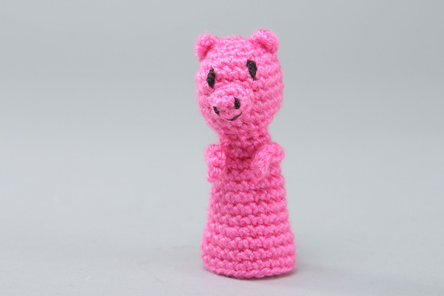Handmade finger puppet in the shape of pink pig crocheted of acrylic threads photo 1