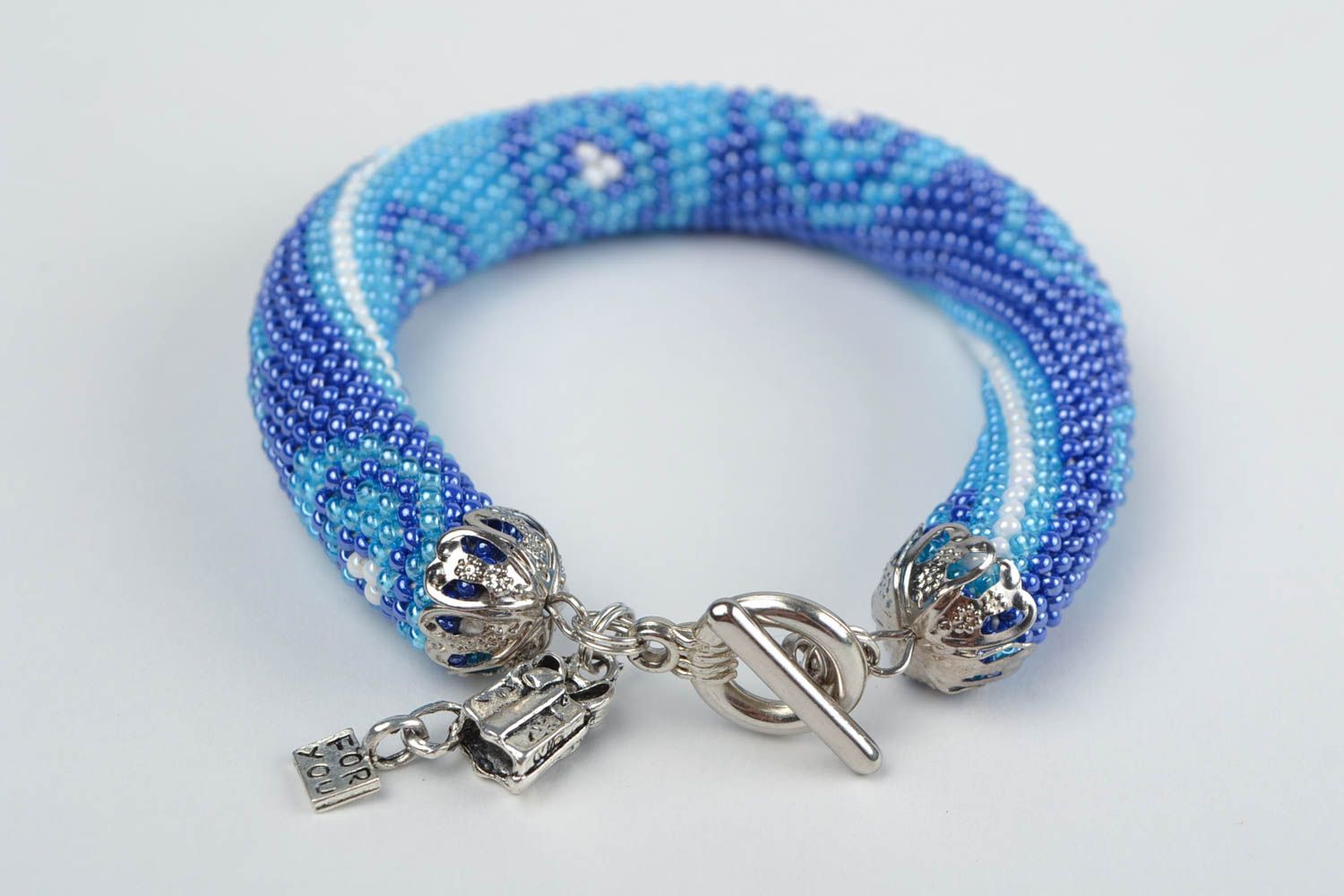 Handmade beautiful beaded cord bracelet light blue with blue ornament photo 5