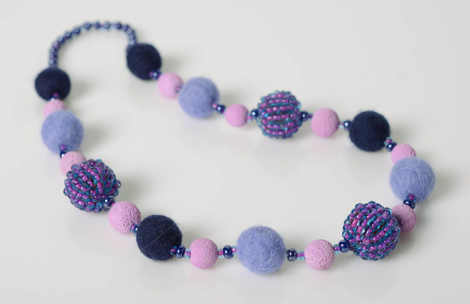 Handmade designer felted wool balls necklace with seed beads in violet color photo 1