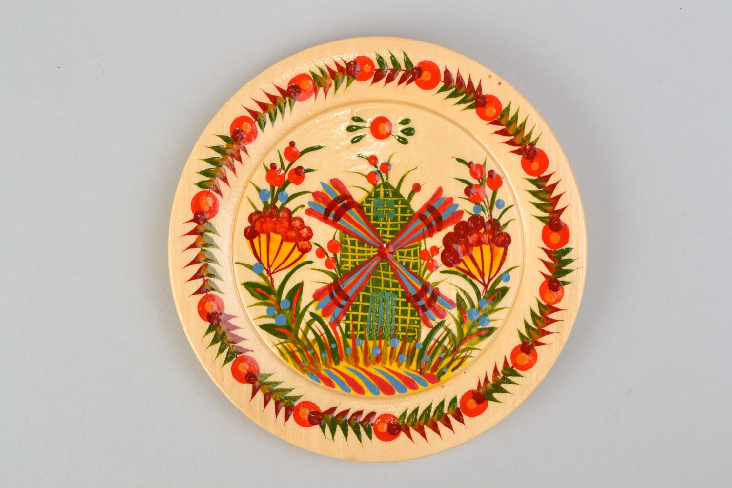 Handmade decorative carved wooden plate with traditional Petrikivka painting photo 5