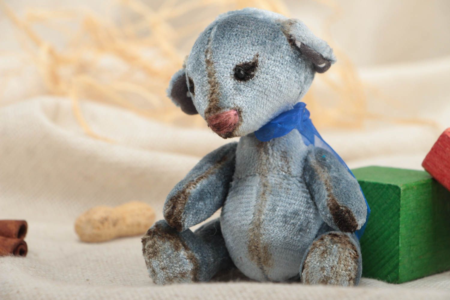 Handmade decorative gray toy bear with small bow interior decor element photo 1