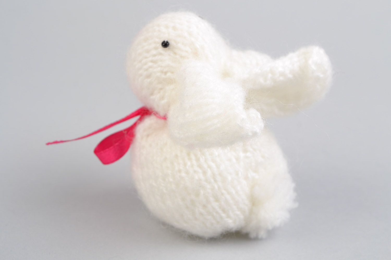 Handmade soft toy knitted of angora wool in the shape of white rabbit with pink bow photo 4
