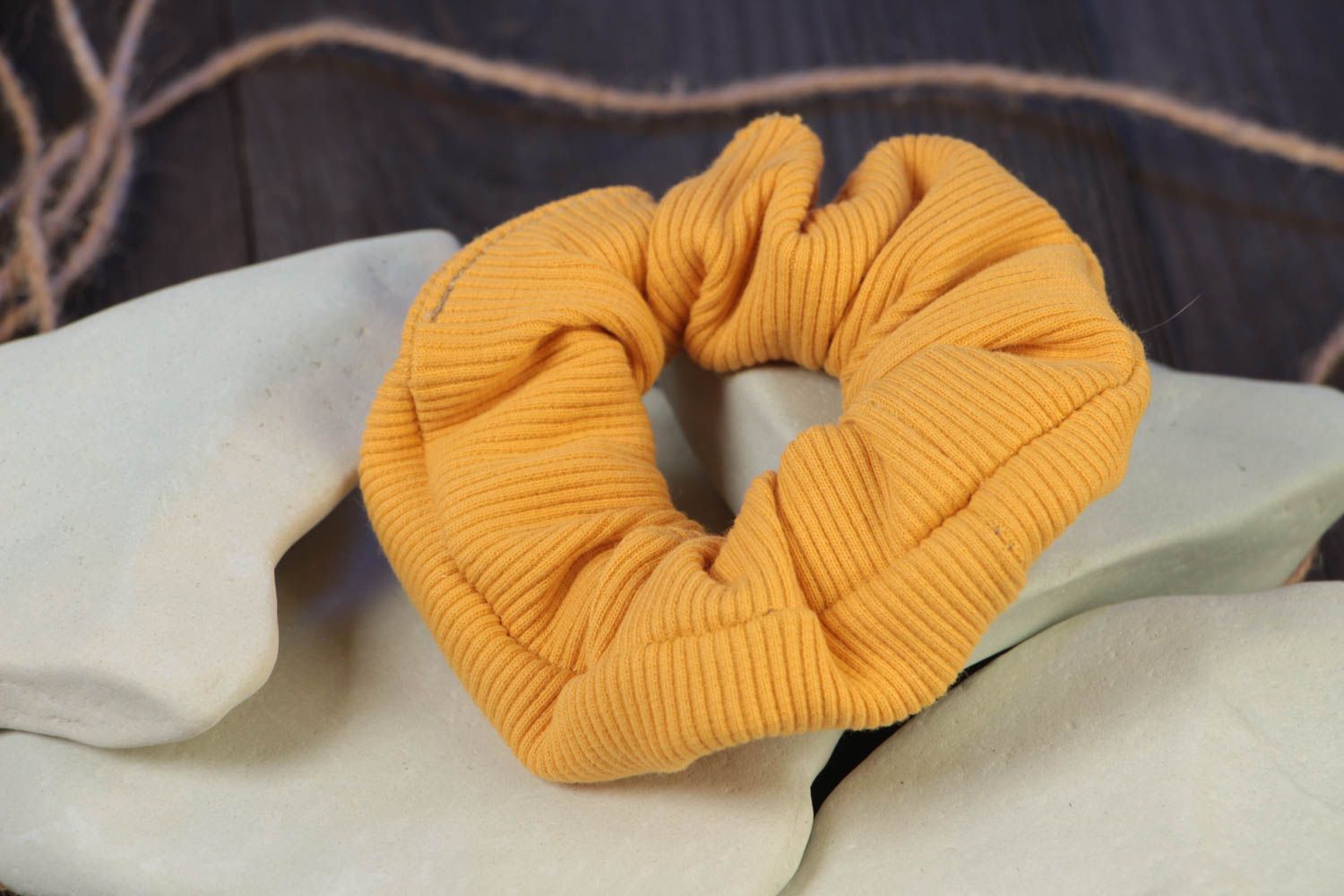 Handmade decorative stretch fabric hair tie of yellow color of laconic design photo 1