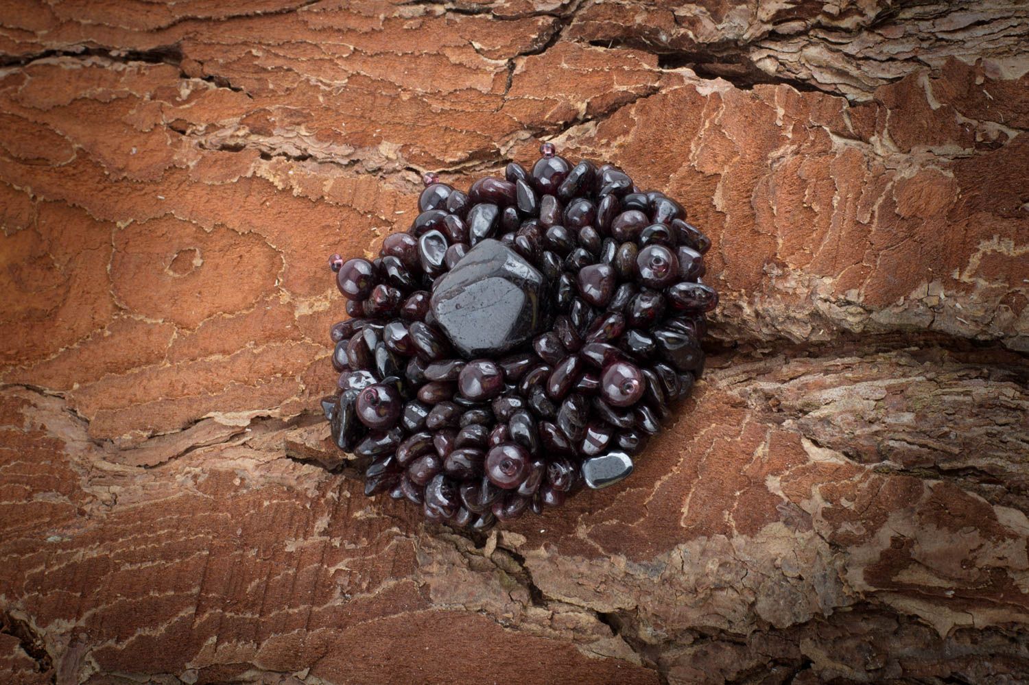 Handmade designer festive brooch with natural garnet stone on leather basis photo 1