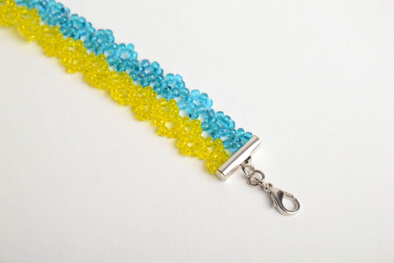 Handmade wrist bracelet crocheted of yellow and blue beads with metal chain photo 5