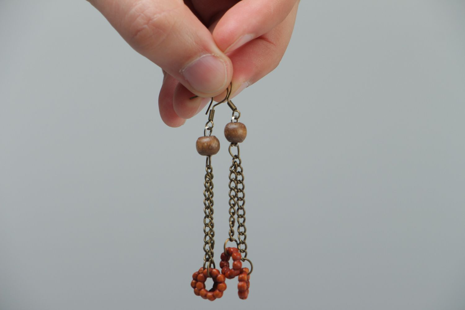 Handmade metal earrings with wooden beads photo 3