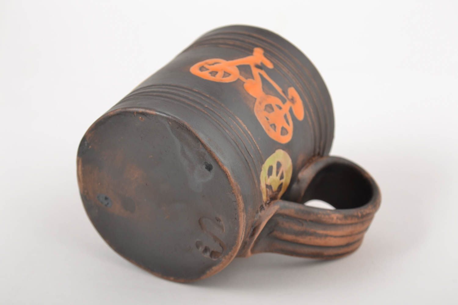8 oz brown and orange ceramic coffee cup with bicycle patter and handle photo 4
