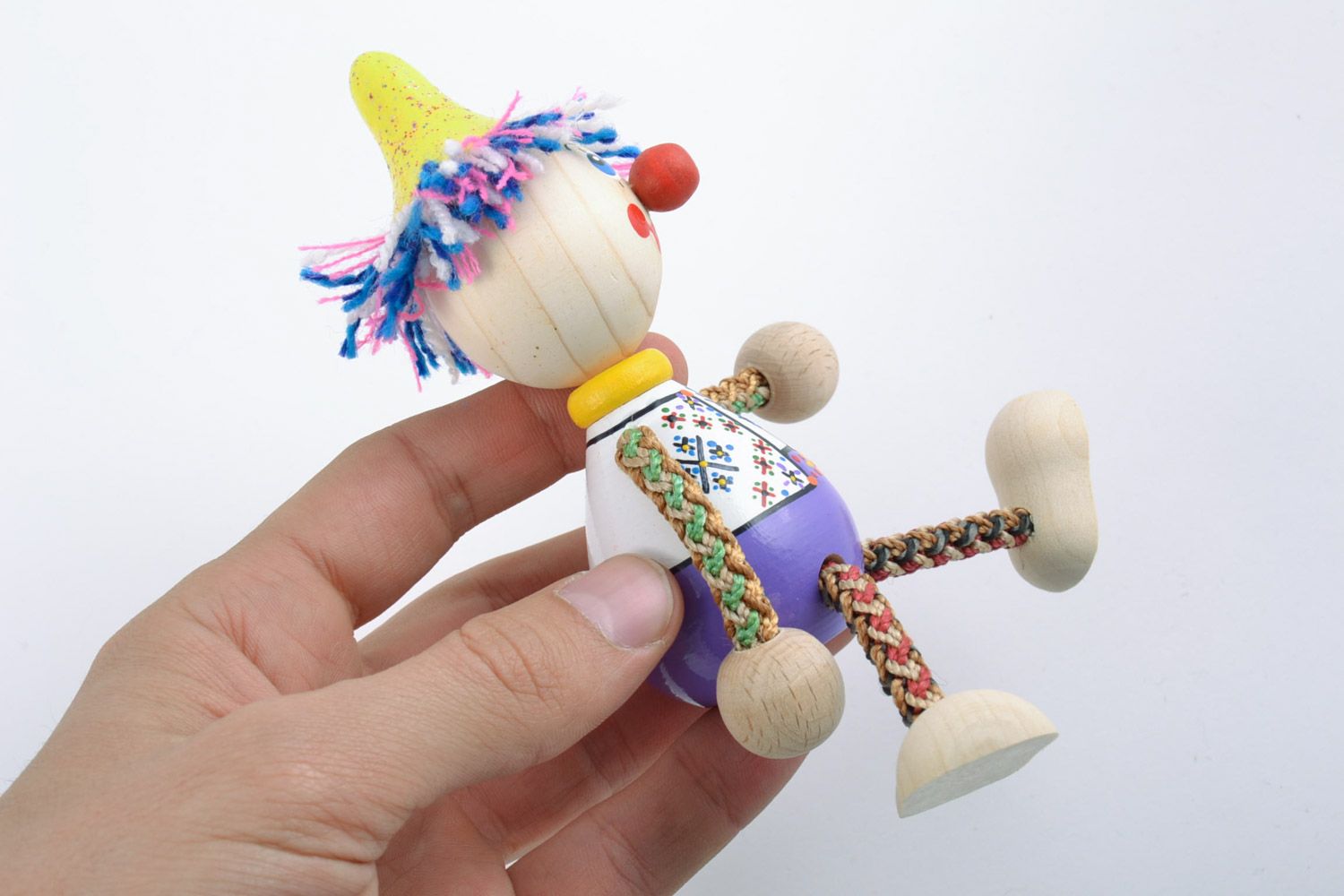 Handmade unusual beautiful wooden toy funny colored clown decorated with eco-paints photo 2