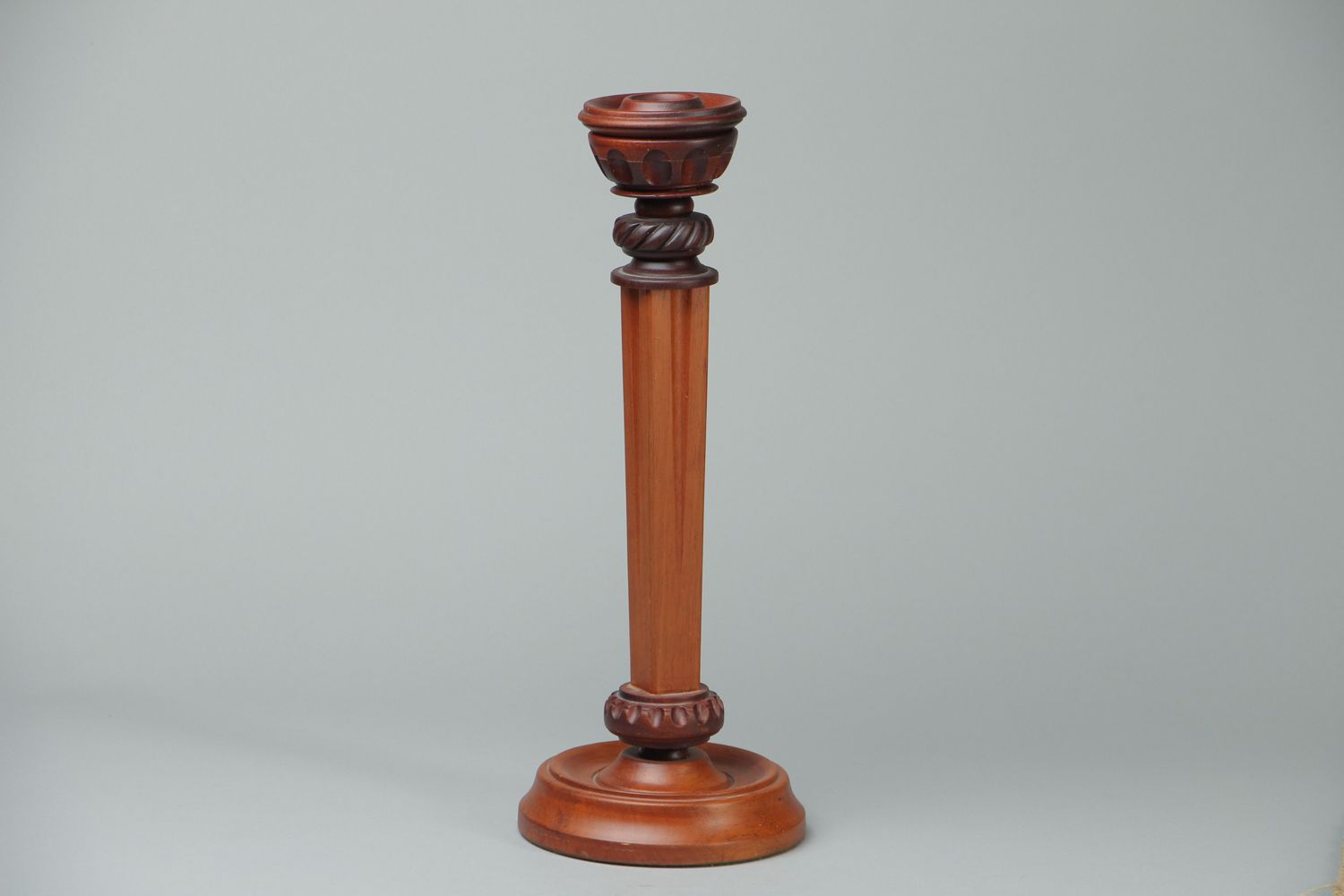 Beautiful carved wooden candlestick photo 1
