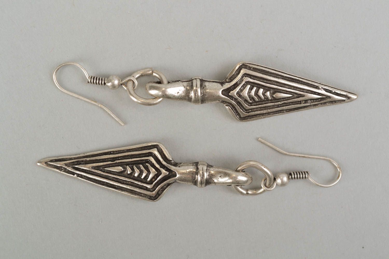 Metal earrings with charms in the shape of pikes photo 3