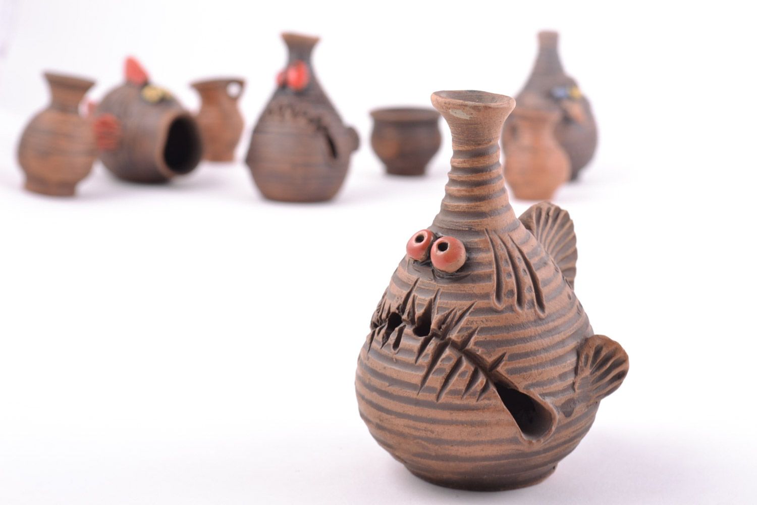 Handmade ceramic souvenir figurine of fish of brown color kilned with milk photo 5
