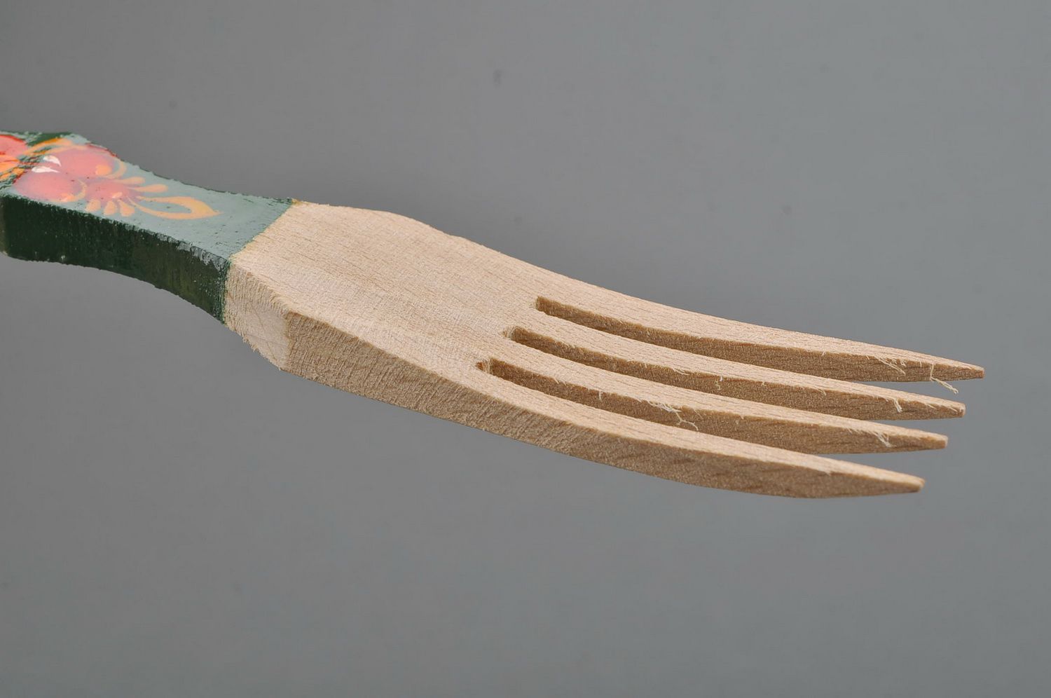 Wooden fork with green handle photo 2