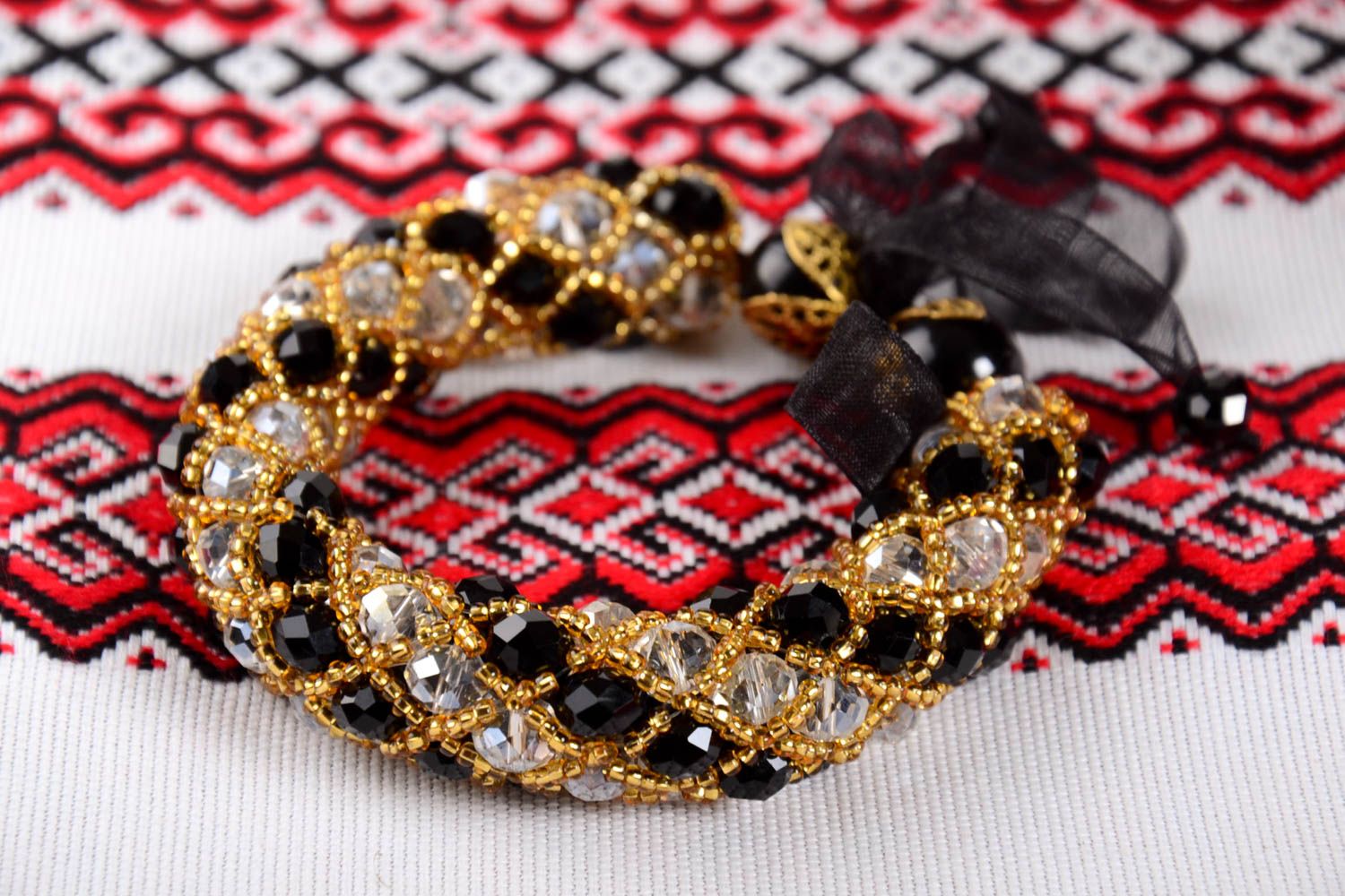 Elegant handmade black and gold color beads large strand bracelet  on a black rope photo 1