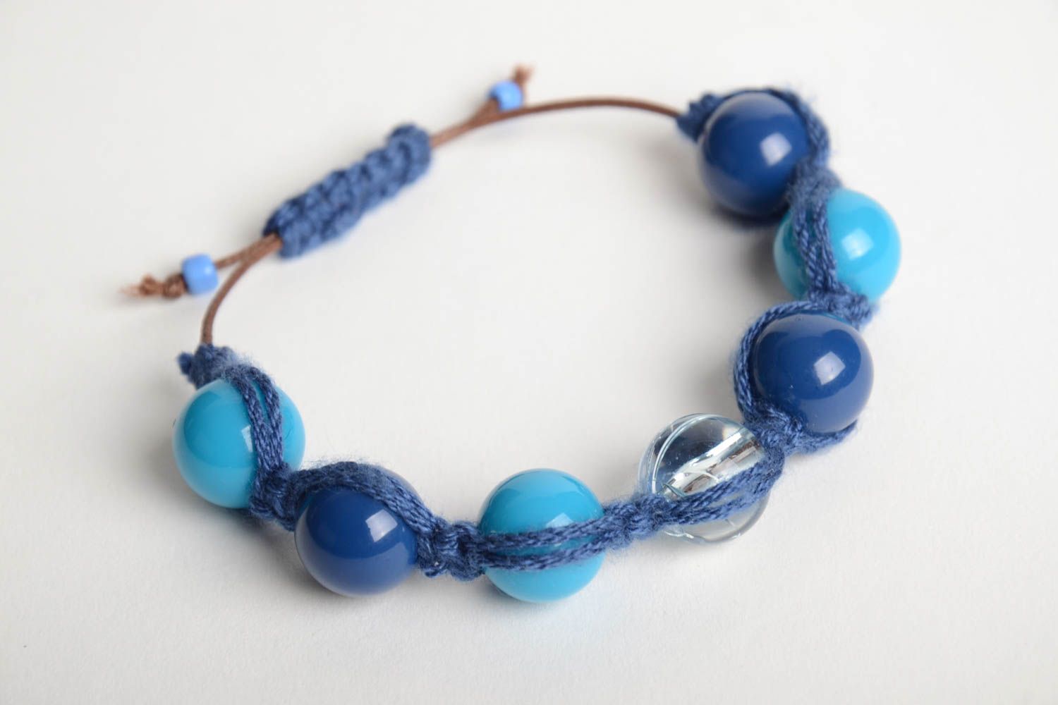 Handmade wrist bracelet crocheted of cord and plastic beads in blue color shades photo 3