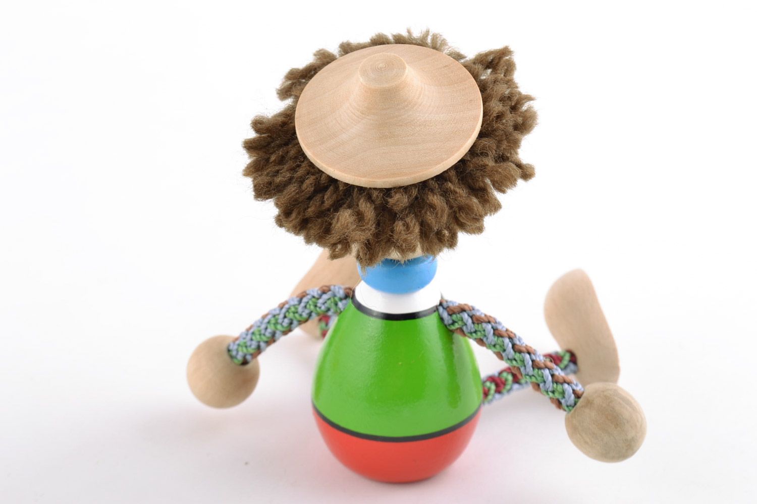 Brightly painted homemade wooden eco toy boy with hat for children and interior photo 5